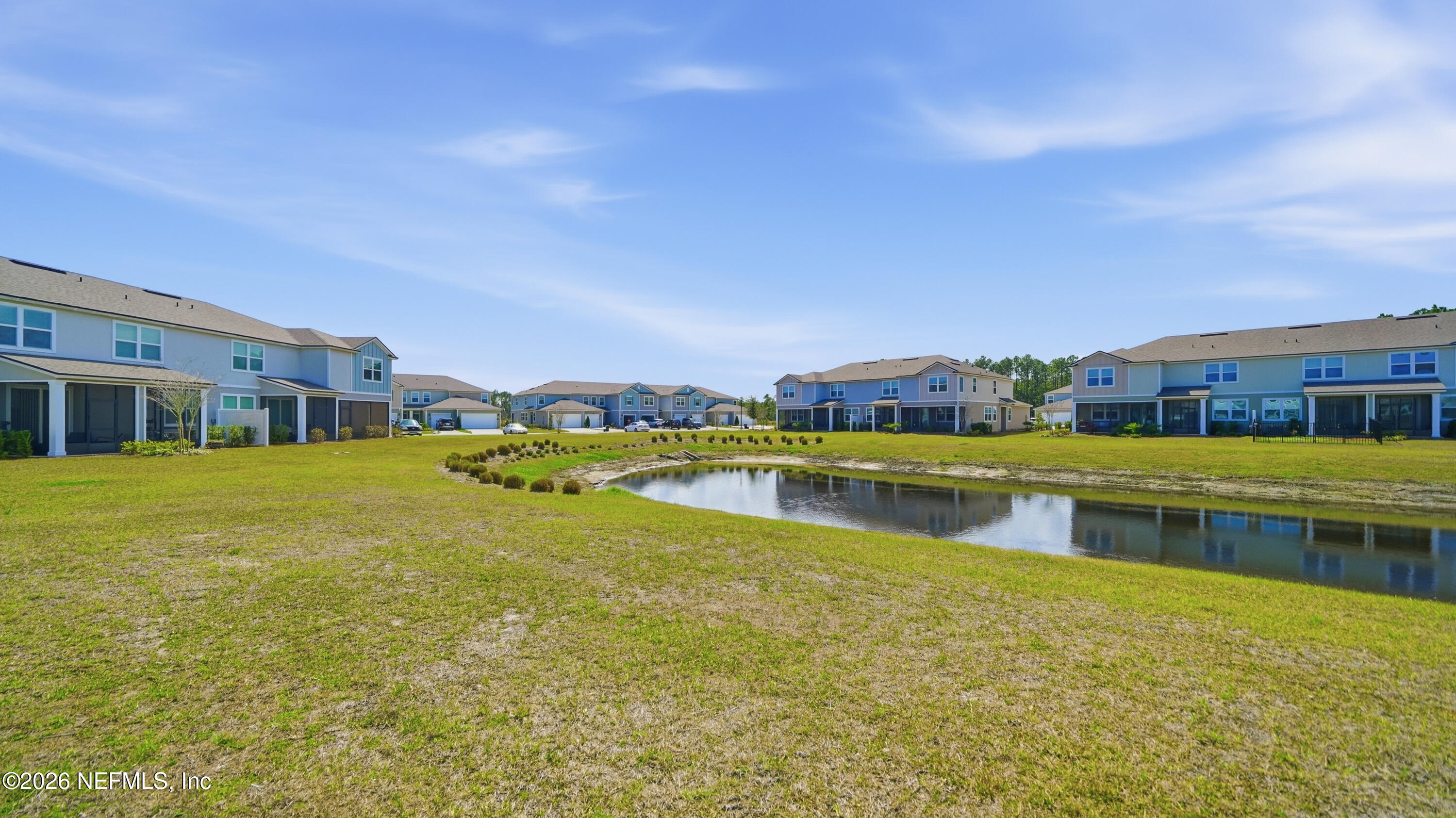 172 Redbud Road Palm Coast, FL 32137 - Photo 33 of 43 a view of a lake with a big yard