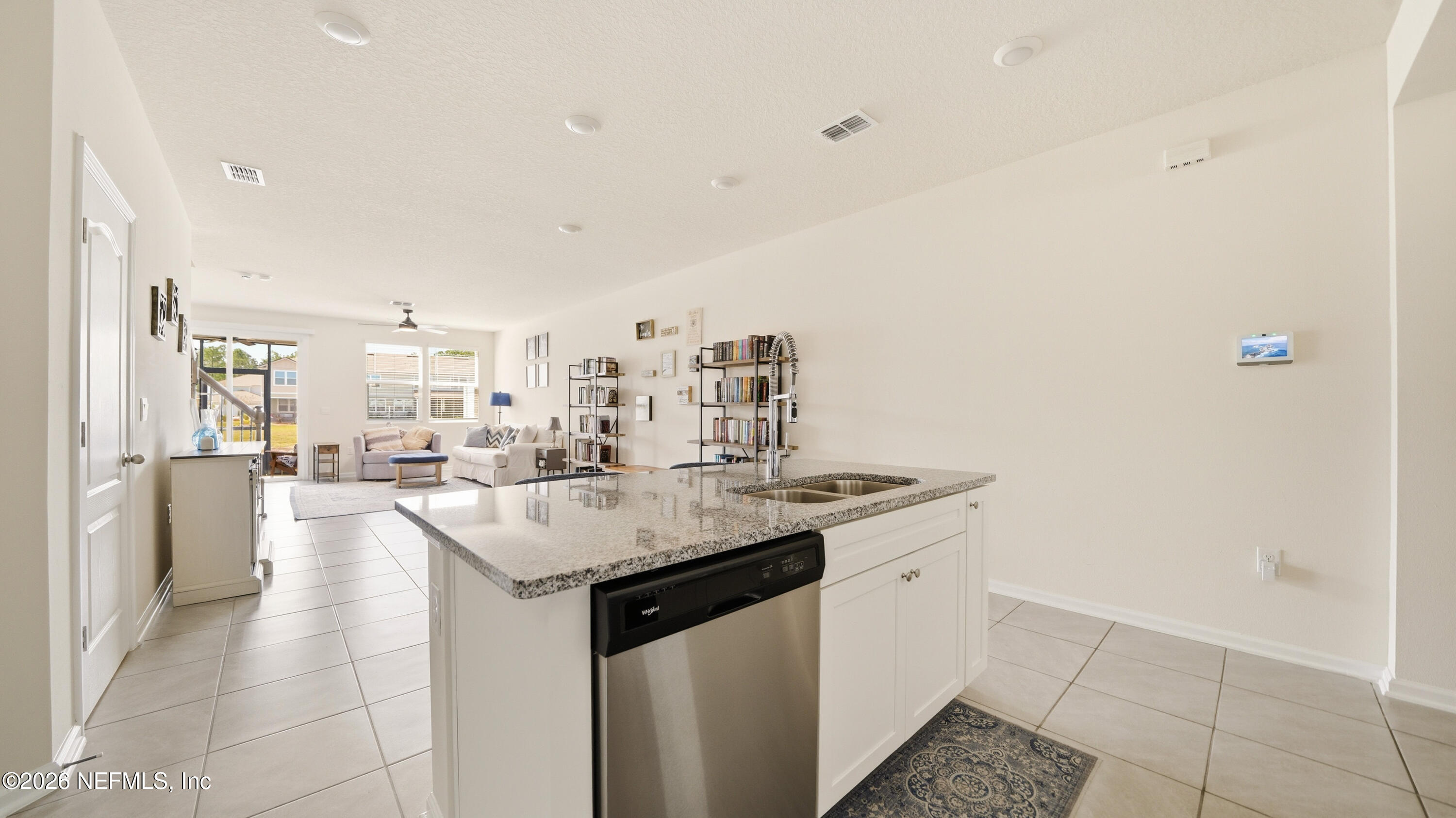 172 Redbud Road Palm Coast, FL 32137 - Photo 7 of 43 a kitchen with a sink and cabinets