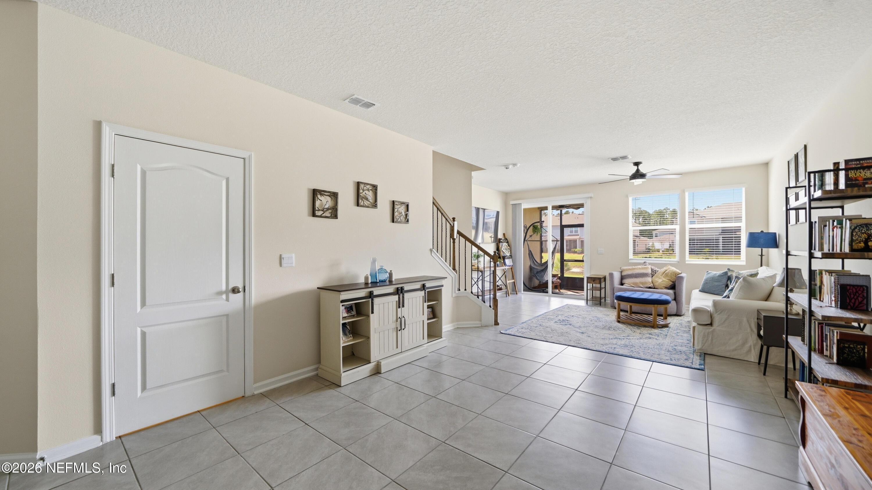 172 Redbud Road Palm Coast, FL 32137 - Photo 9 of 43 a living room with furniture and a large window
