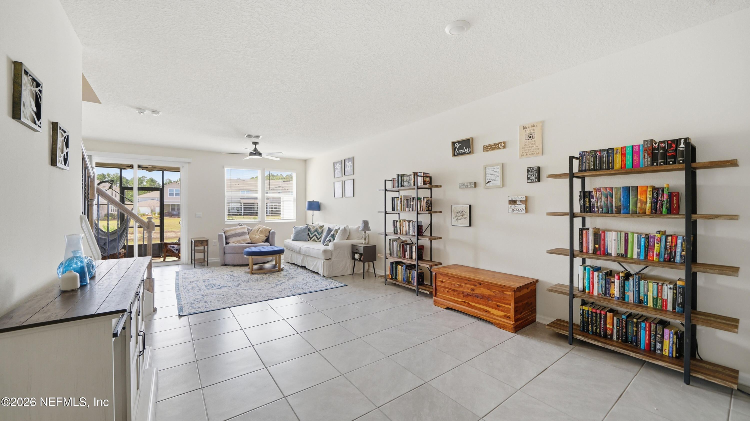 172 Redbud Road Palm Coast, FL 32137 - Photo 10 of 43 a living room with furniture and book shelf