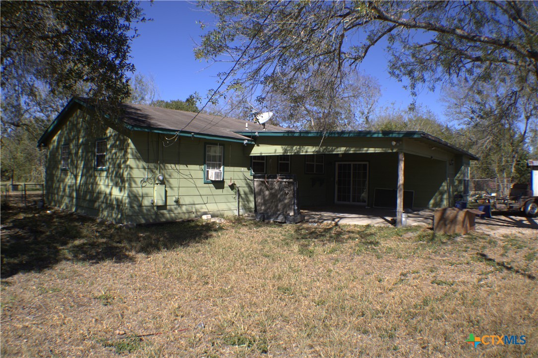206 Meadowbrook Street Dale, TX 78616 - Photo 4 of 10 a front view of a house with a yard and garage