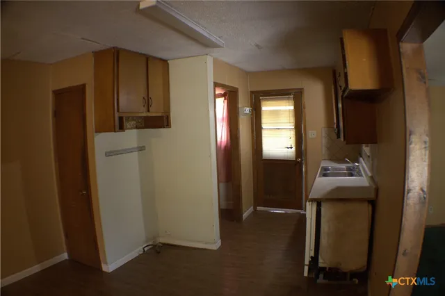 a room that has a dresser in it