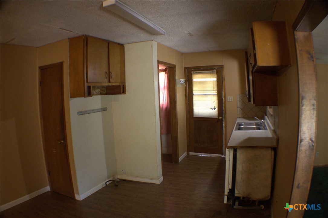 206 Meadowbrook Street Dale, TX 78616 - Photo 5 of 10 a room that has a dresser in it