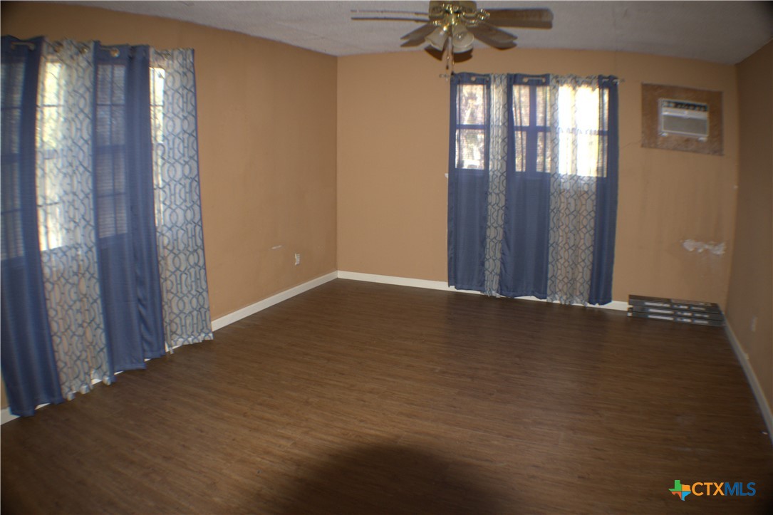 206 Meadowbrook Street Dale, TX 78616 - Photo 6 of 10 a view of an empty room with a window