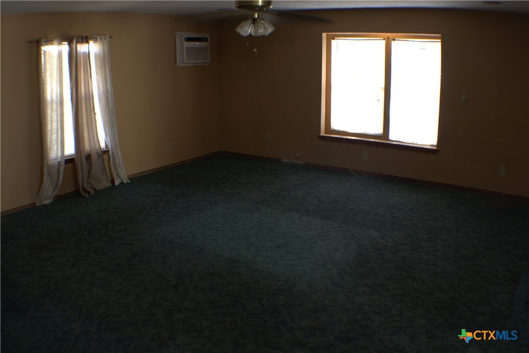 206 Meadowbrook Street Dale, TX 78616 - Photo 10 of 10 an empty room with a window