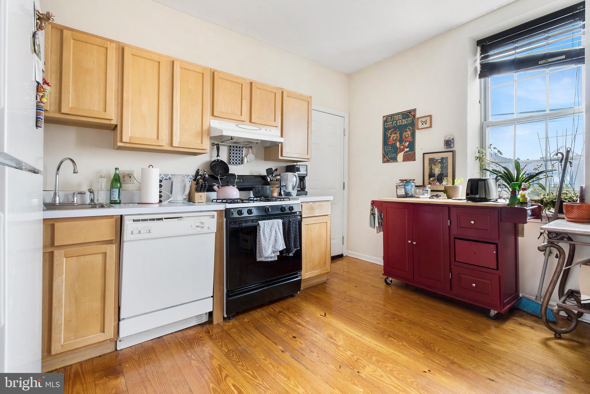321-23 North Front Street, Unit 4 Philadelphia, PA 19106 - Photo 6 of 15 a kitchen with a sink stove and cabinets