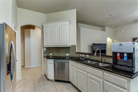 a bedroom with a bed and a table