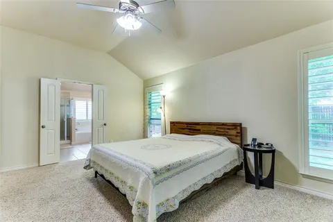 a bathroom with a tub sink shower and a mirror
