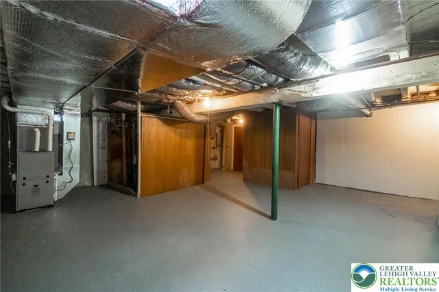 a bathroom with a toilet a sink and shower