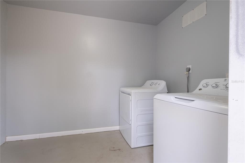 6216 Southwest 10th Place, Unit B Gainesville, FL 32607 - Photo 20 of 24 a utility room with dryer and washer