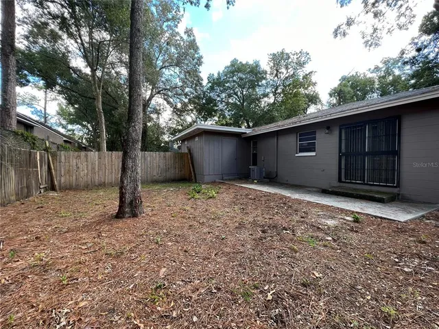 a backyard of a house with lots of green space