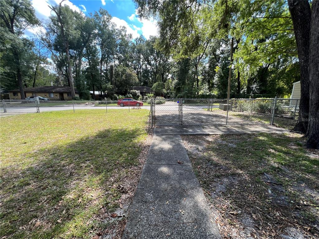 6216 Southwest 10th Place, Unit B Gainesville, FL 32607 - Photo 24 of 24 a view of a yard with trees