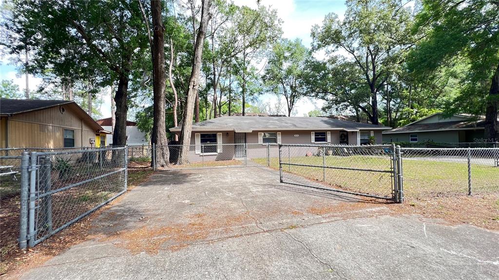 6216 Southwest 10th Place, Unit B Gainesville, FL 32607 - Photo 6 of 24 front view of house with a yard