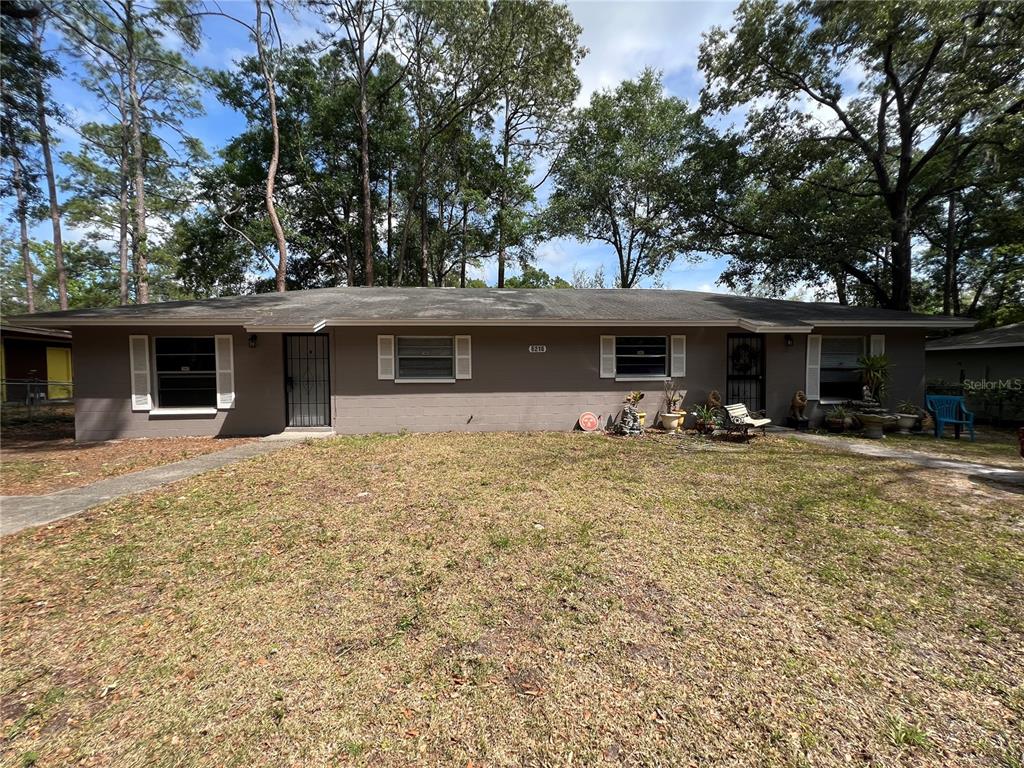 6216 Southwest 10th Place, Unit B Gainesville, FL 32607 - Photo 7 of 24 a front view of a house with swimming pool