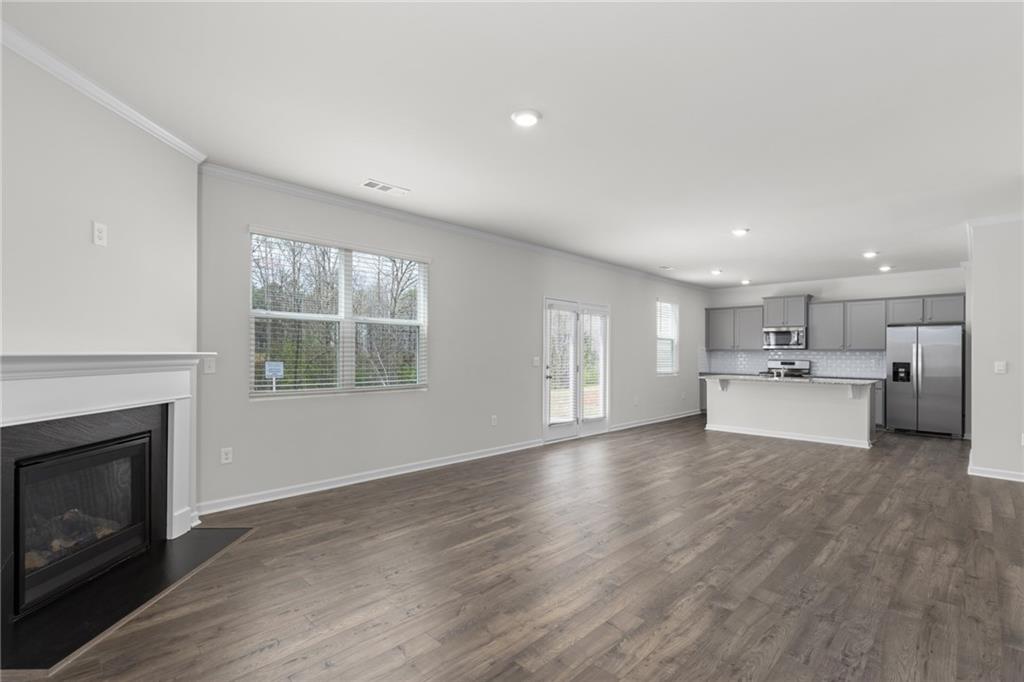 5370 Swan Lane Powder Springs, GA 30127 - Photo 15 of 54 a view of kitchen with furniture and fireplace