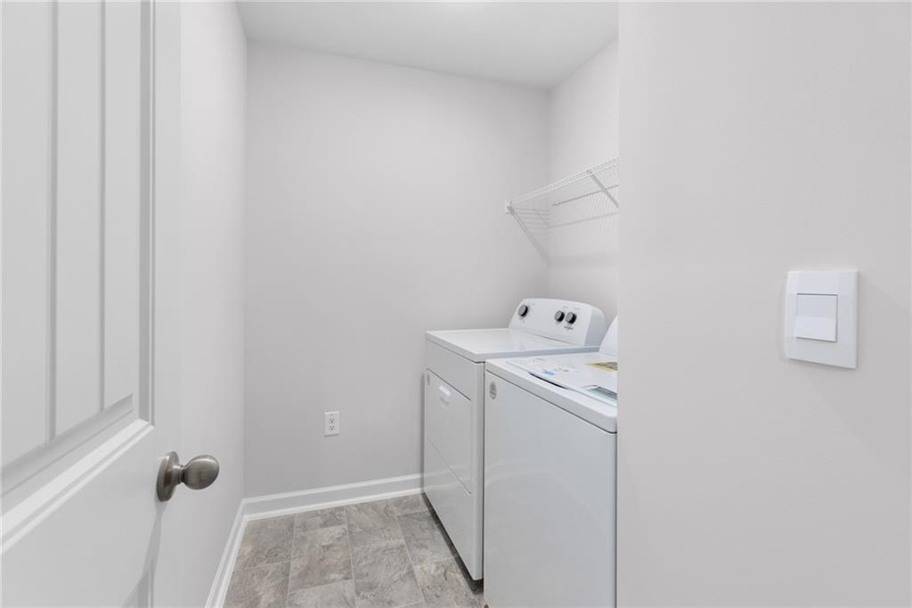 5370 Swan Lane Powder Springs, GA 30127 - Photo 27 of 54 a utility room with dryer and washer