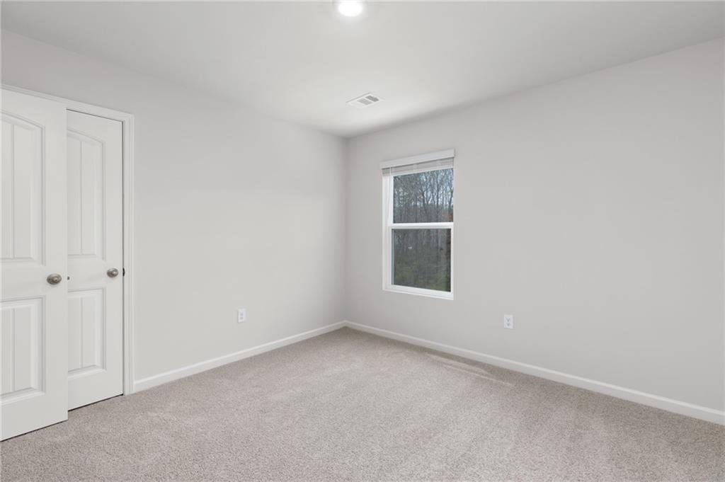 5370 Swan Lane Powder Springs, GA 30127 - Photo 31 of 54 a view of an empty room with a window