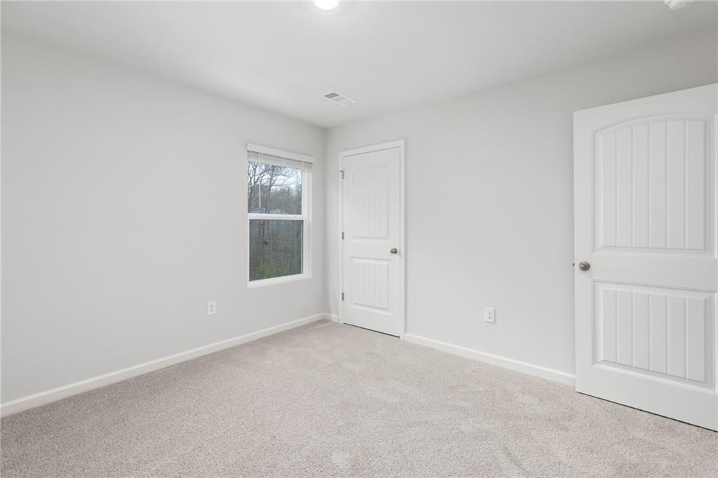 5370 Swan Lane Powder Springs, GA 30127 - Photo 33 of 54 a view of an empty room with a window