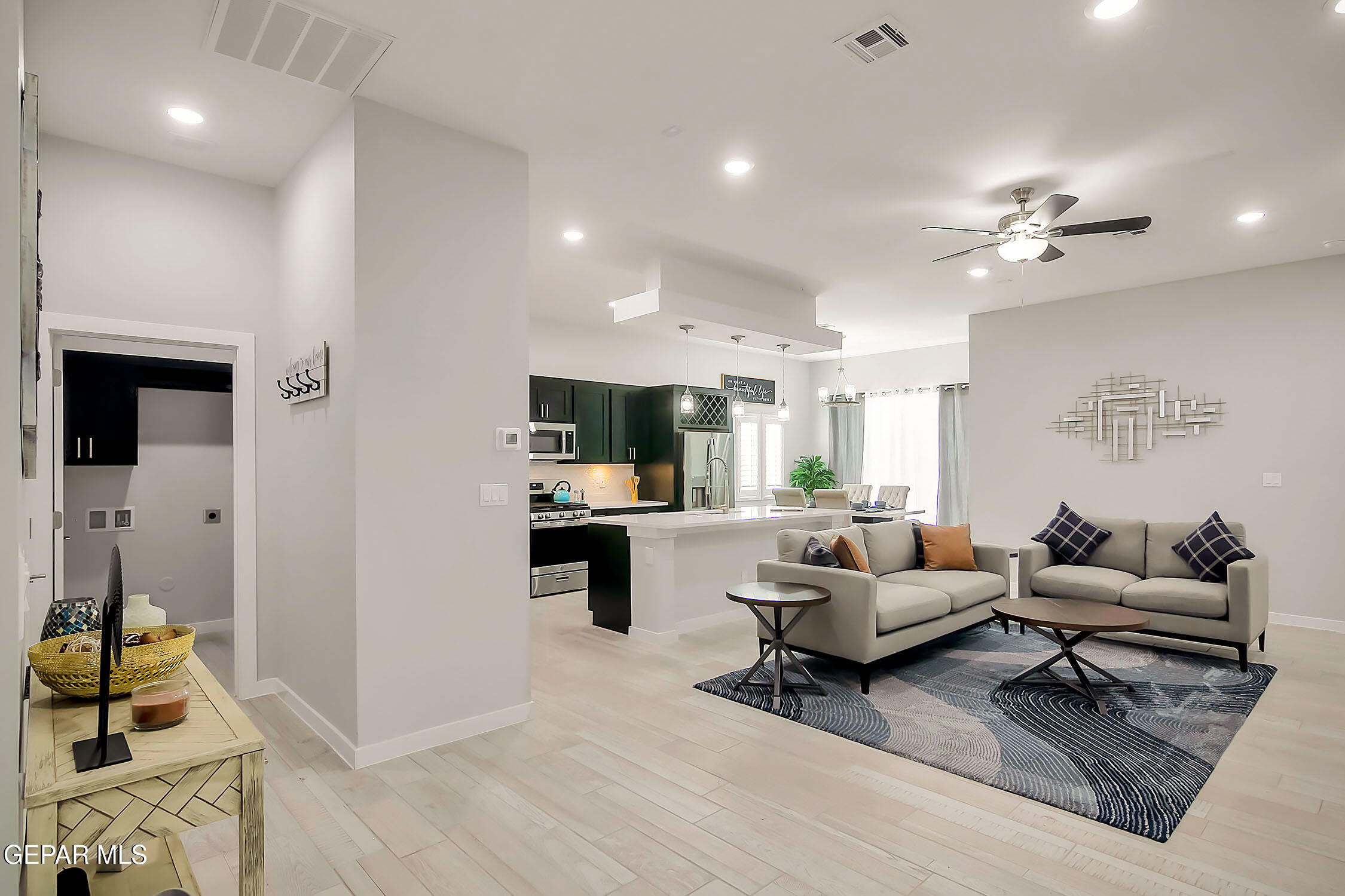 3853 Object Place El Paso, TX 79938 - Photo 14 of 31 a living room with furniture hard wood floor and a ceiling fan