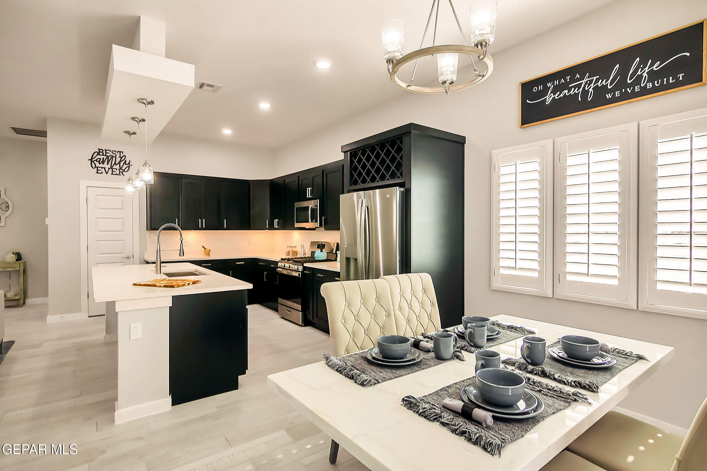 3853 Object Place El Paso, TX 79938 - Photo 24 of 31 a kitchen with stainless steel appliances granite countertop a sink stove and refrigerator