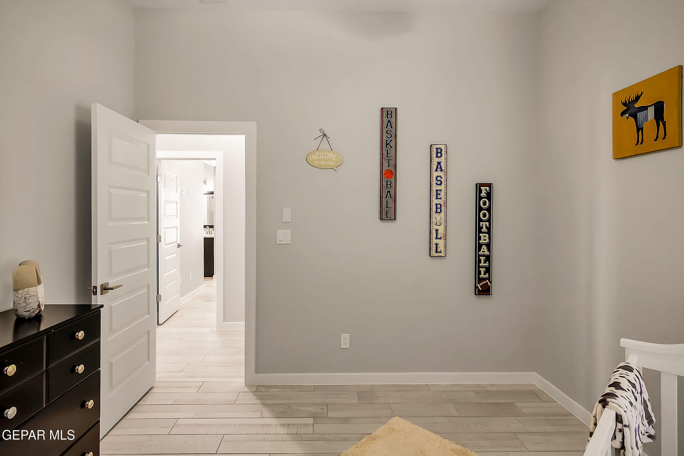 3853 Object Place El Paso, TX 79938 - Photo 27 of 31 a view of a bedroom with wooden floor and cabinet
