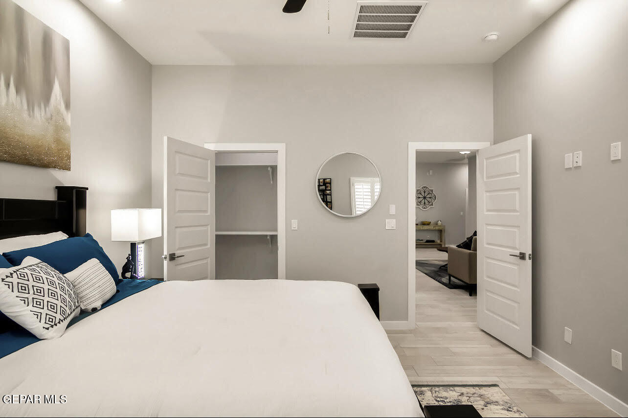 3853 Object Place El Paso, TX 79938 - Photo 3 of 31 a bedroom with a large bed and a large mirror