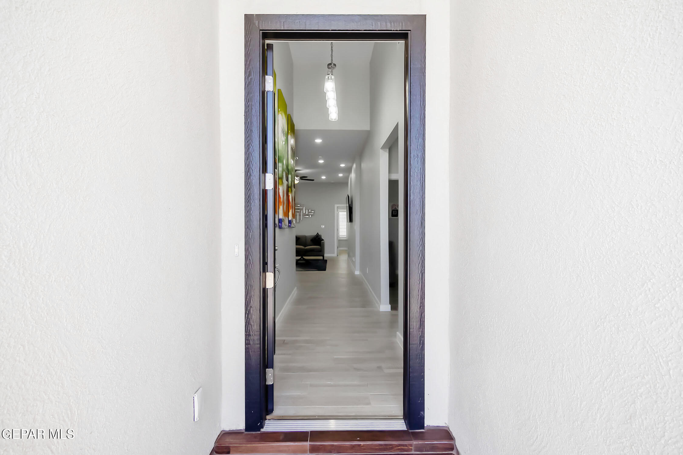 3853 Object Place El Paso, TX 79938 - Photo 5 of 31 a view of a hallway with wooden floor