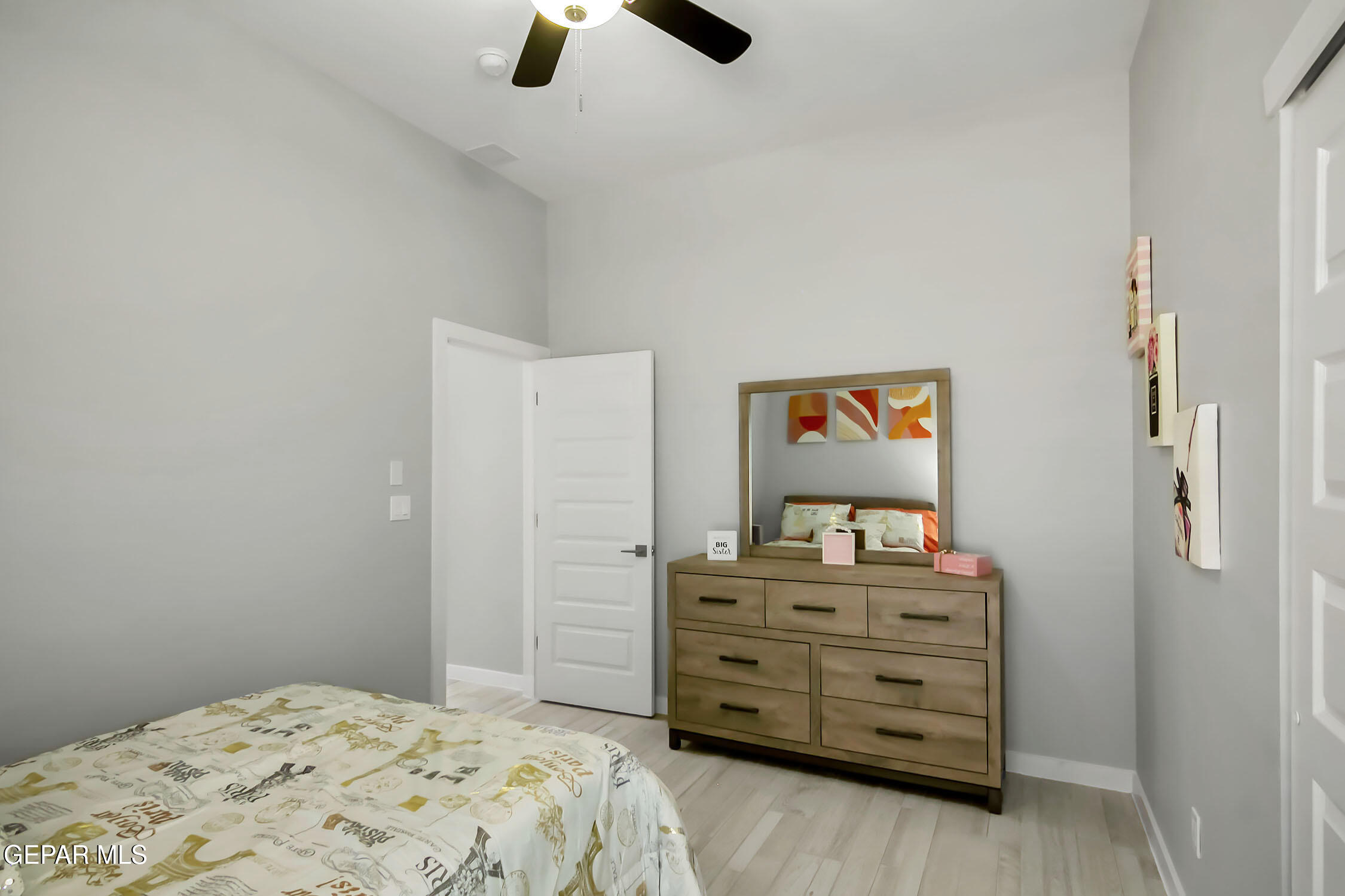 3853 Object Place El Paso, TX 79938 - Photo 9 of 31 a bedroom with a dresser and a mirror