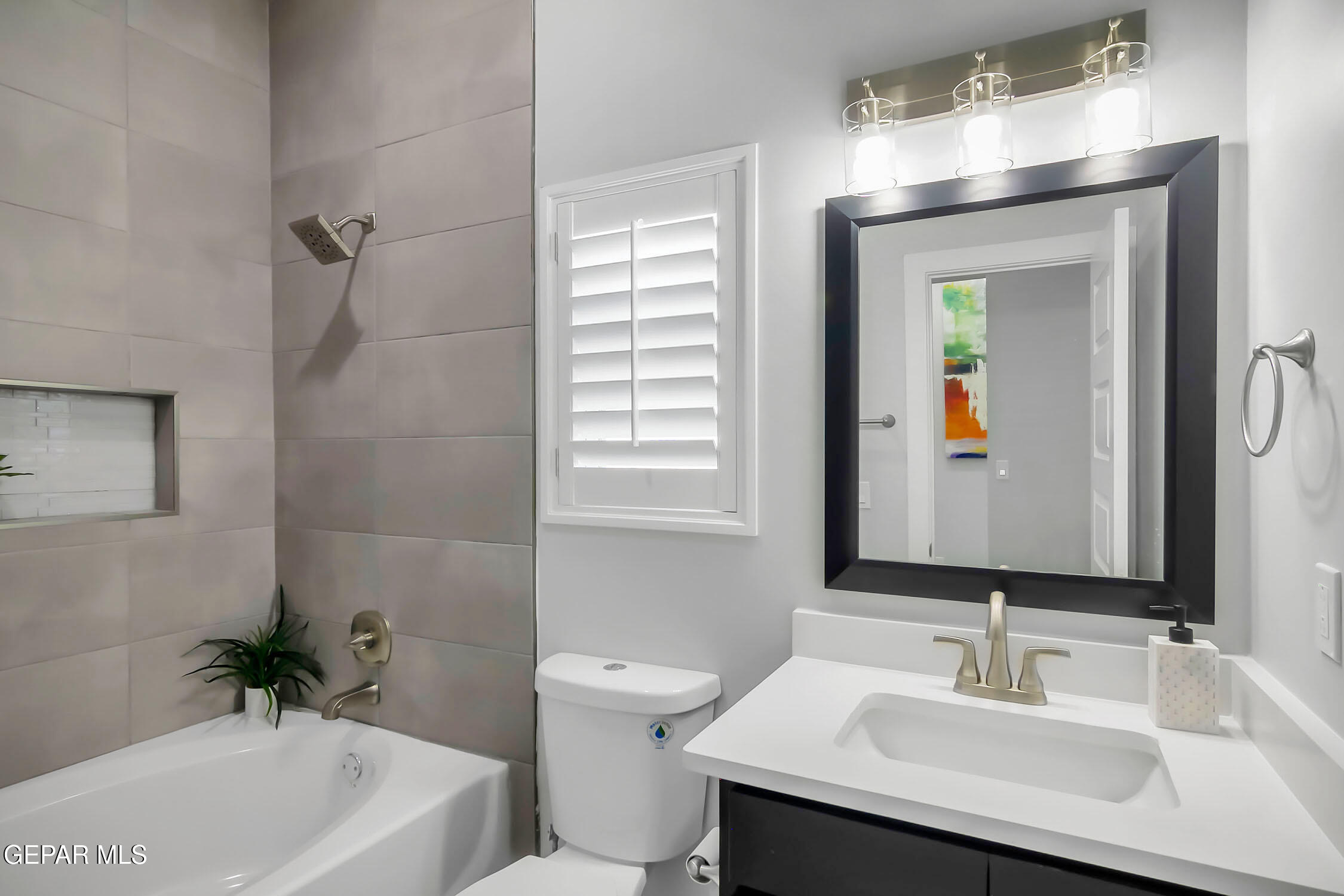 3853 Object Place El Paso, TX 79938 - Photo 10 of 31 a bathroom with a sink a toilet and shower