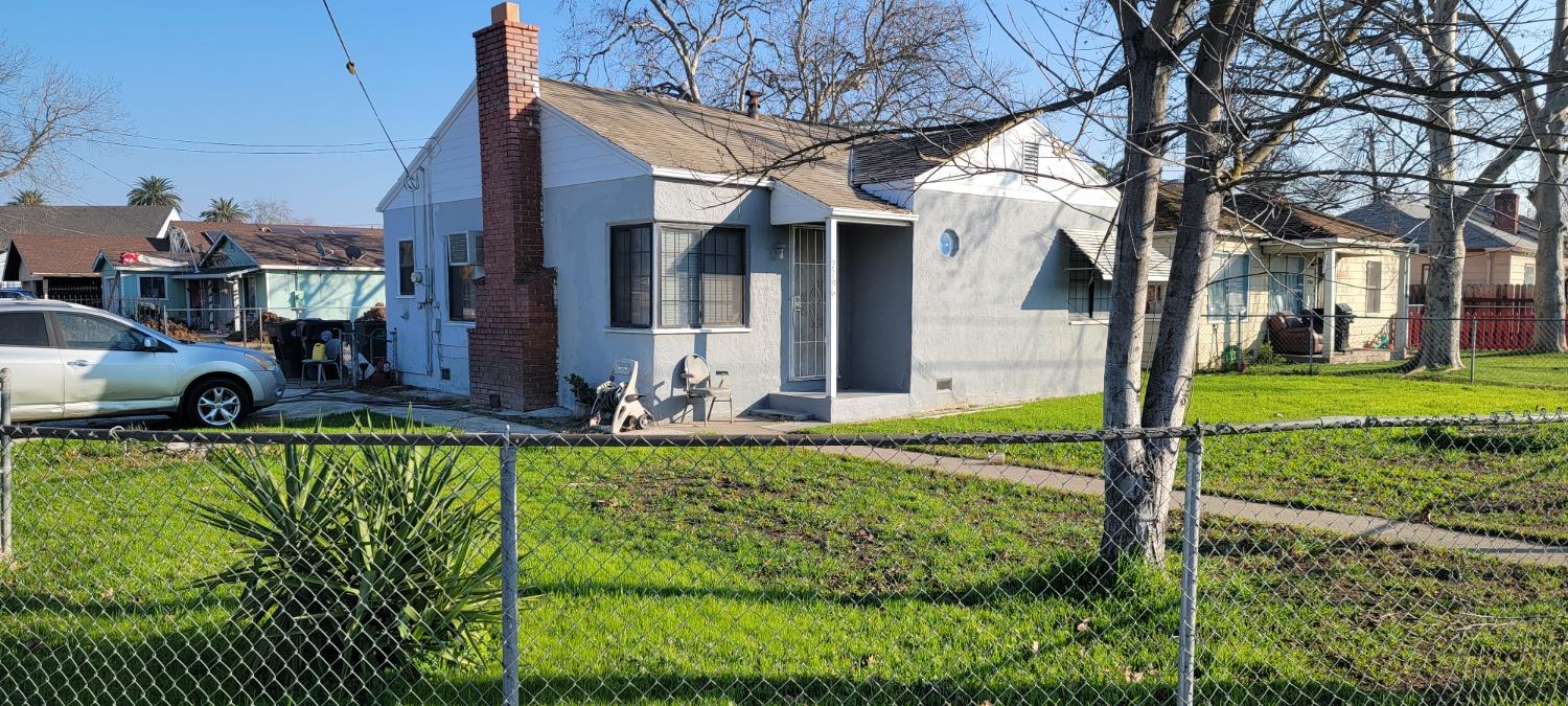 2796 Branch Street Sacramento, CA 95815 - Photo 1 of 17 a view of a house with backyard and sitting area