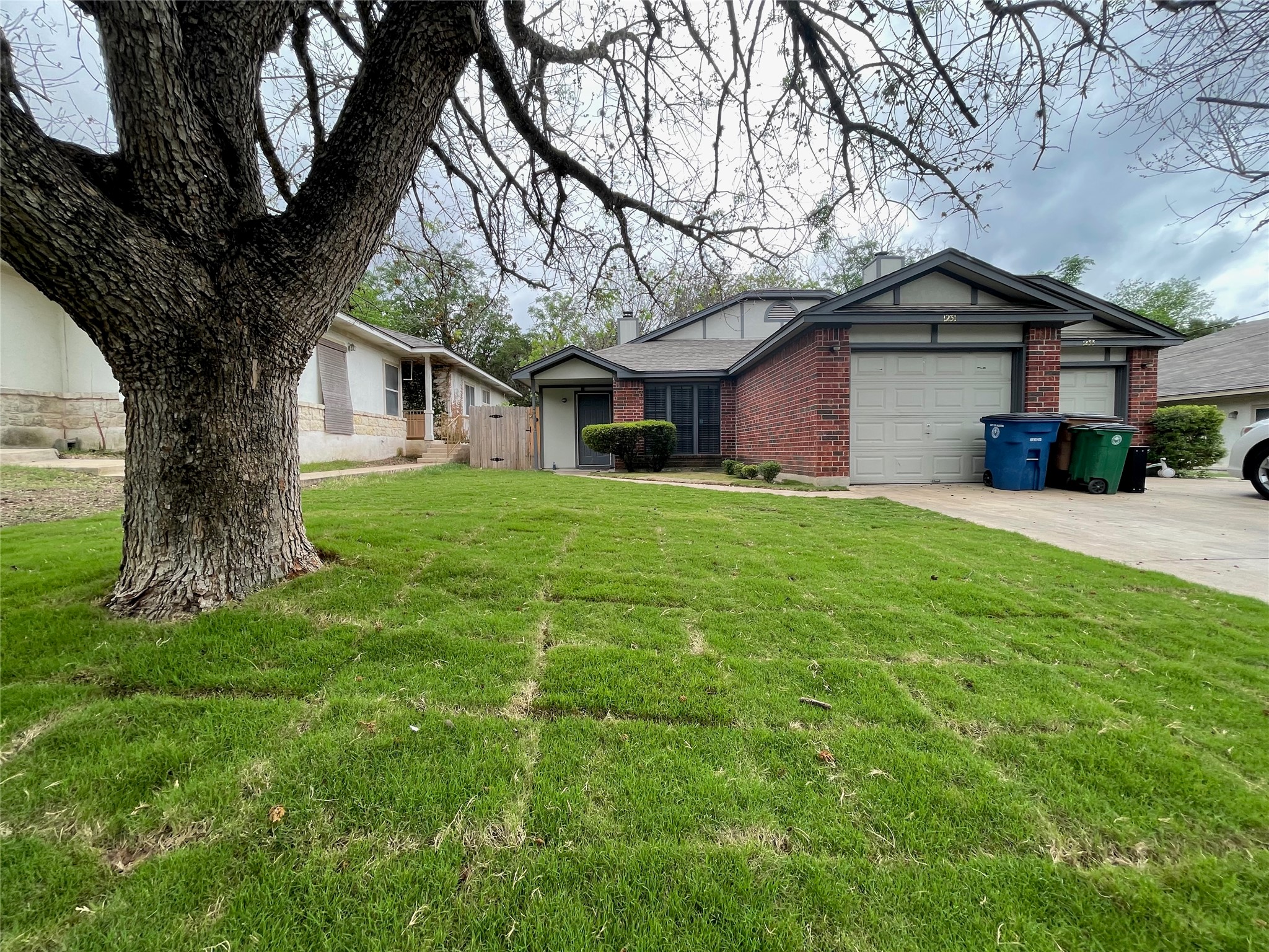 1231 Armadillo Road Austin, TX 78745 - Photo 1 of 1 a front view of a house with yard and tree