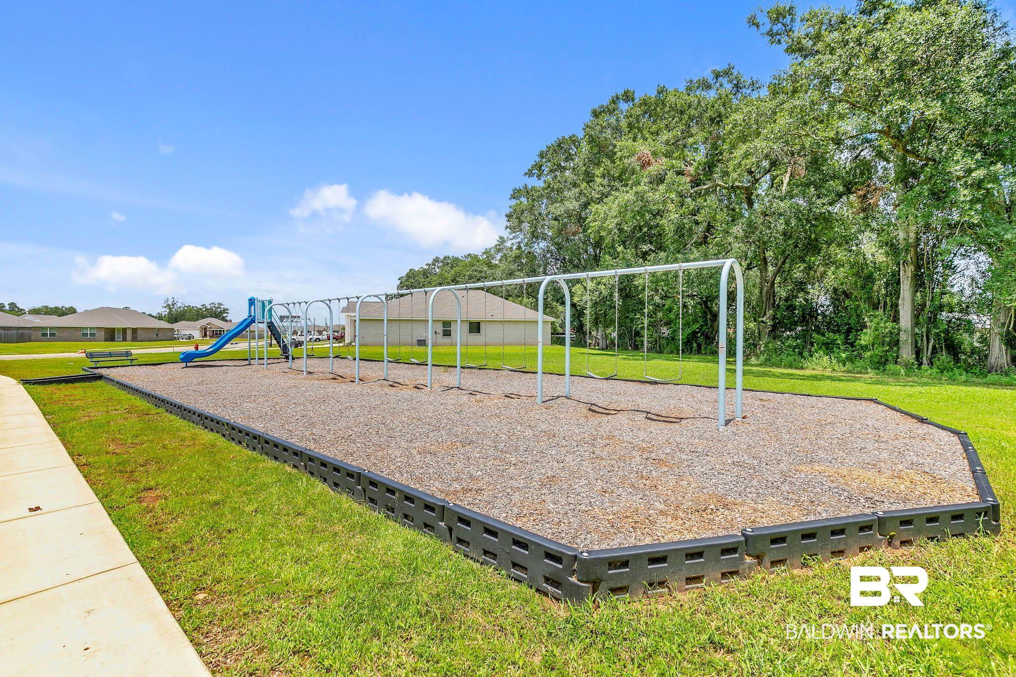 17217 REFLECTION Street Loxley, AL 36551 - Photo 49 of 83 Community play area featuring a yard