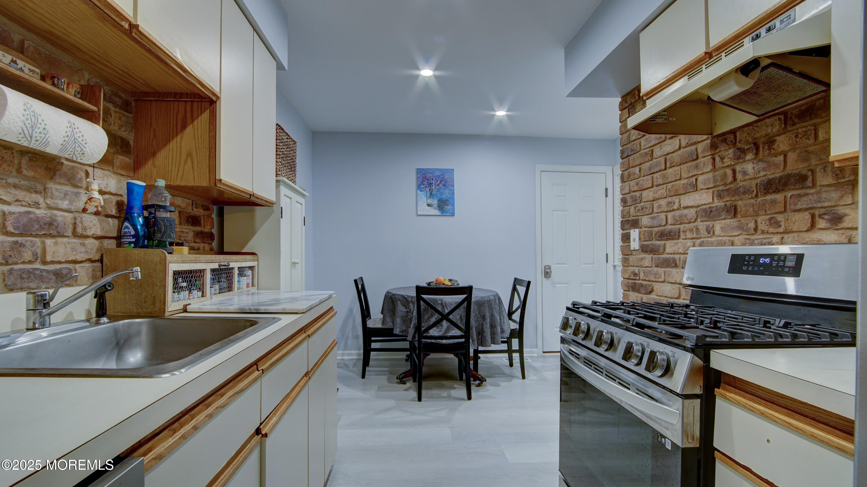 57 Chestnut Way Manalapan, NJ 07726 - Photo 11 of 23 a kitchen that has a sink and a stove