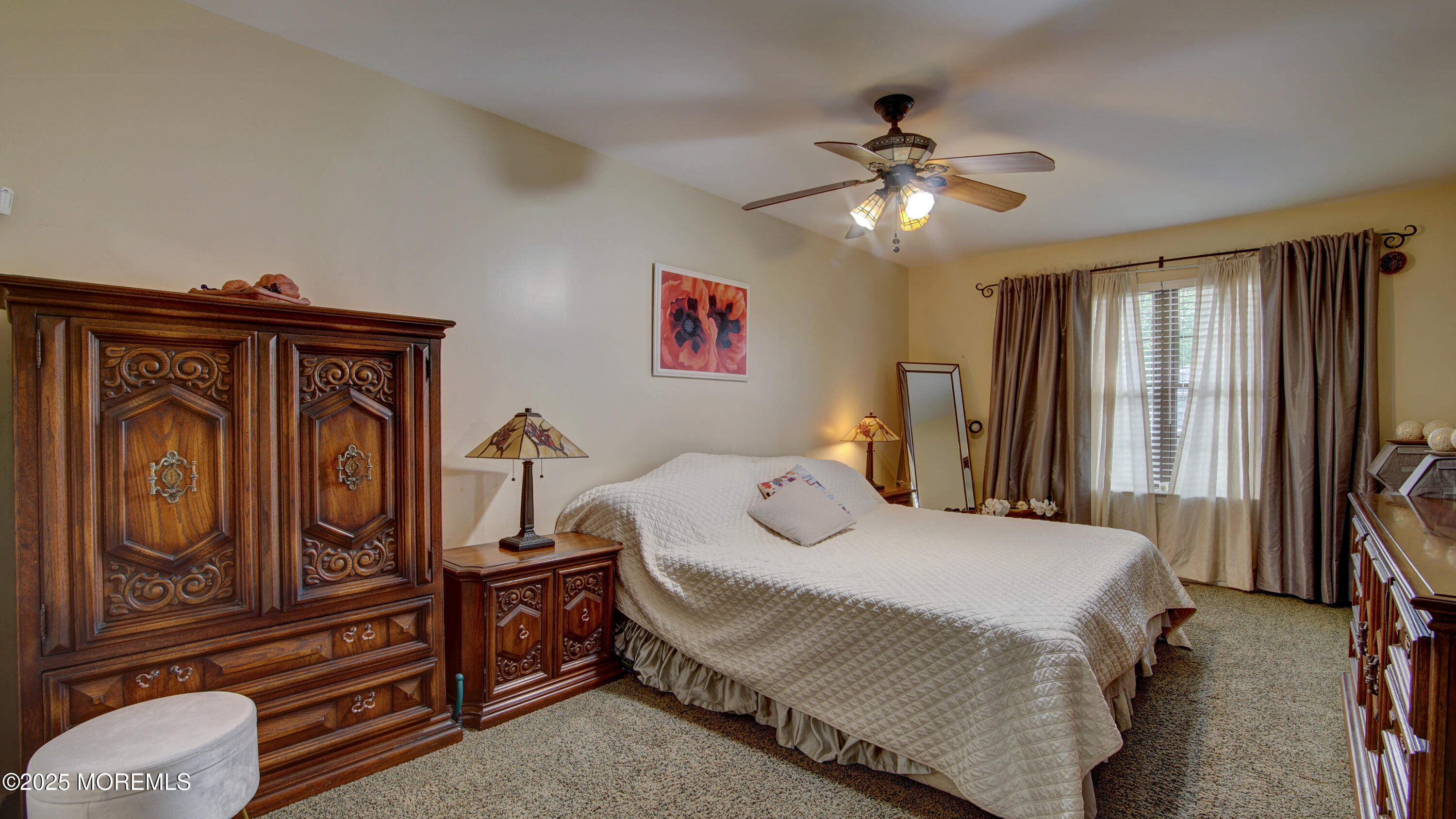 57 Chestnut Way Manalapan, NJ 07726 - Photo 13 of 23 a bedroom with a bed and a chandelier