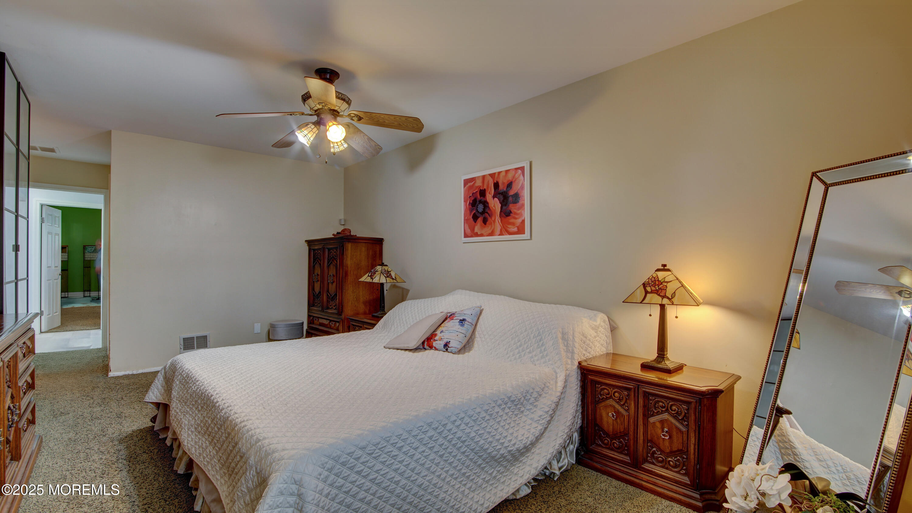 57 Chestnut Way Manalapan, NJ 07726 - Photo 14 of 23 a bedroom with a bed and a chandelier