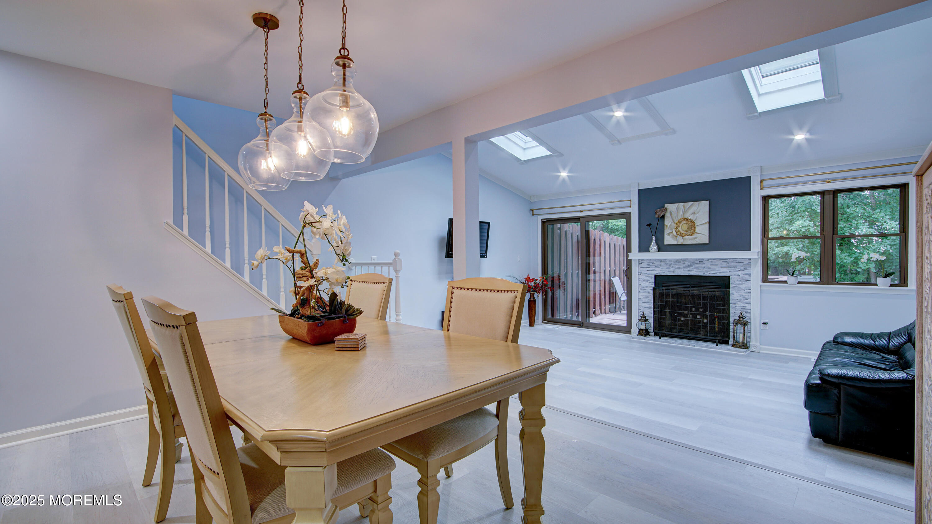 57 Chestnut Way Manalapan, NJ 07726 - Photo 2 of 23 a view of a dining room with furniture and a fireplace