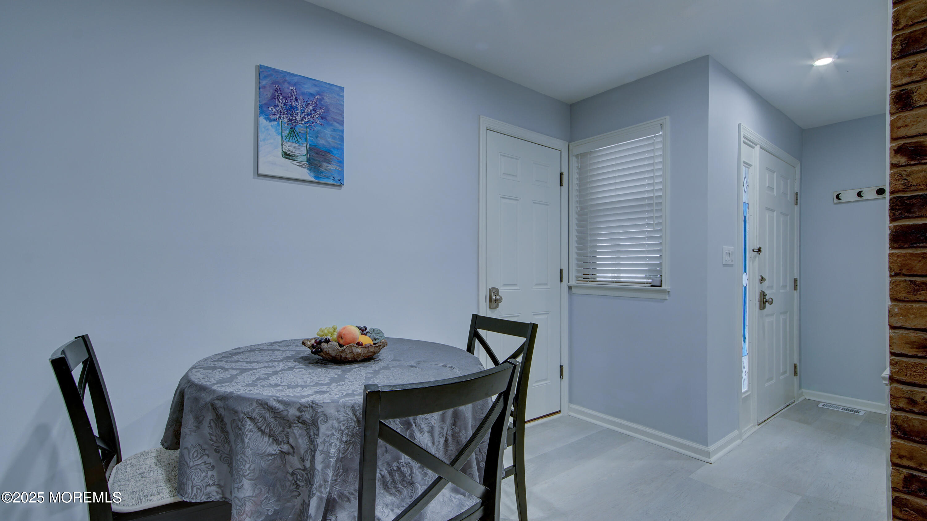 57 Chestnut Way Manalapan, NJ 07726 - Photo 9 of 23 a view of a dining room with furniture and wooden floor