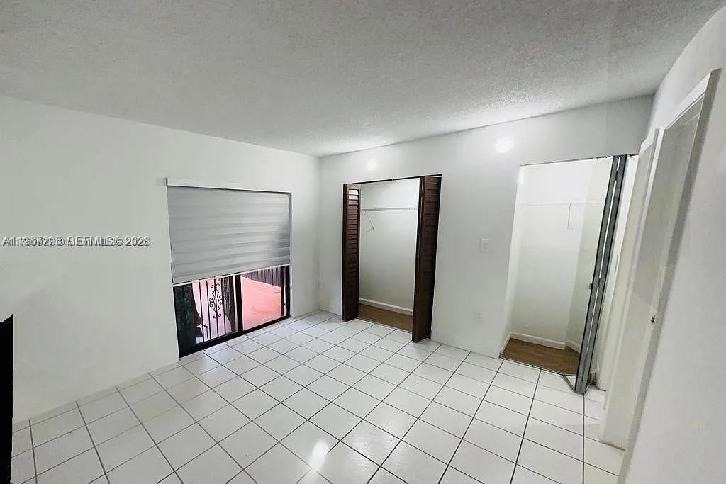 2170 West 60th Street, Unit 16205 Hialeah, FL 33016 - Photo 4 of 6 a view of a room with window and bathroom