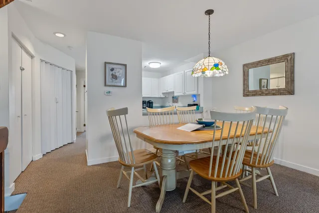 a view of a dining room and a table