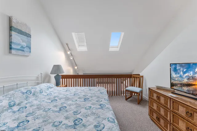 a bedroom with furniture and a baby crib