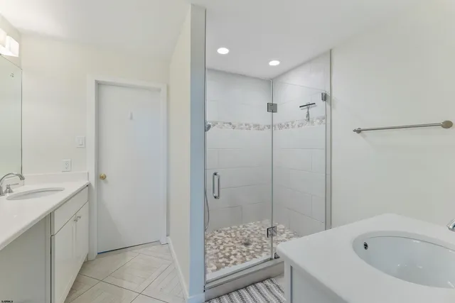 a bathroom with a bathtub and a sink