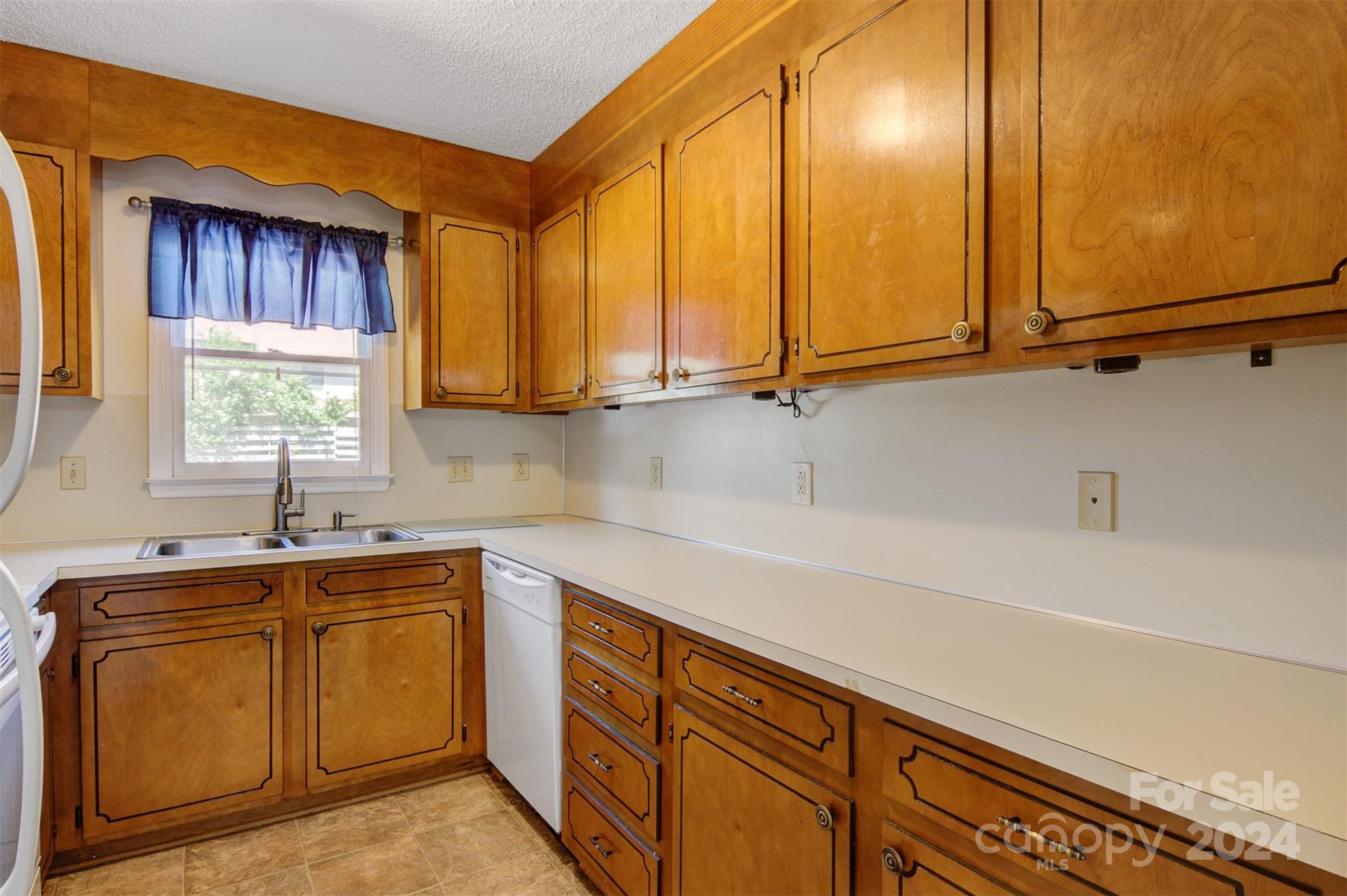 1318 5th Street Northeast Hickory, NC 28601 - Photo 16 of 27 a kitchen with a sink cabinets and window