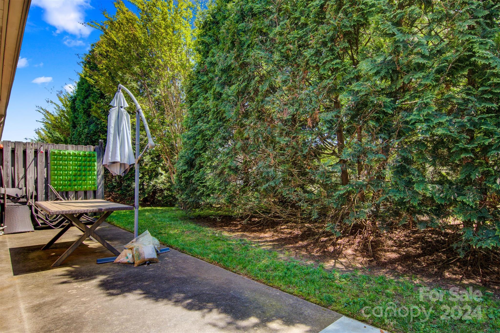 1318 5th Street Northeast Hickory, NC 28601 - Photo 25 of 27 a view of a backyard with sitting area