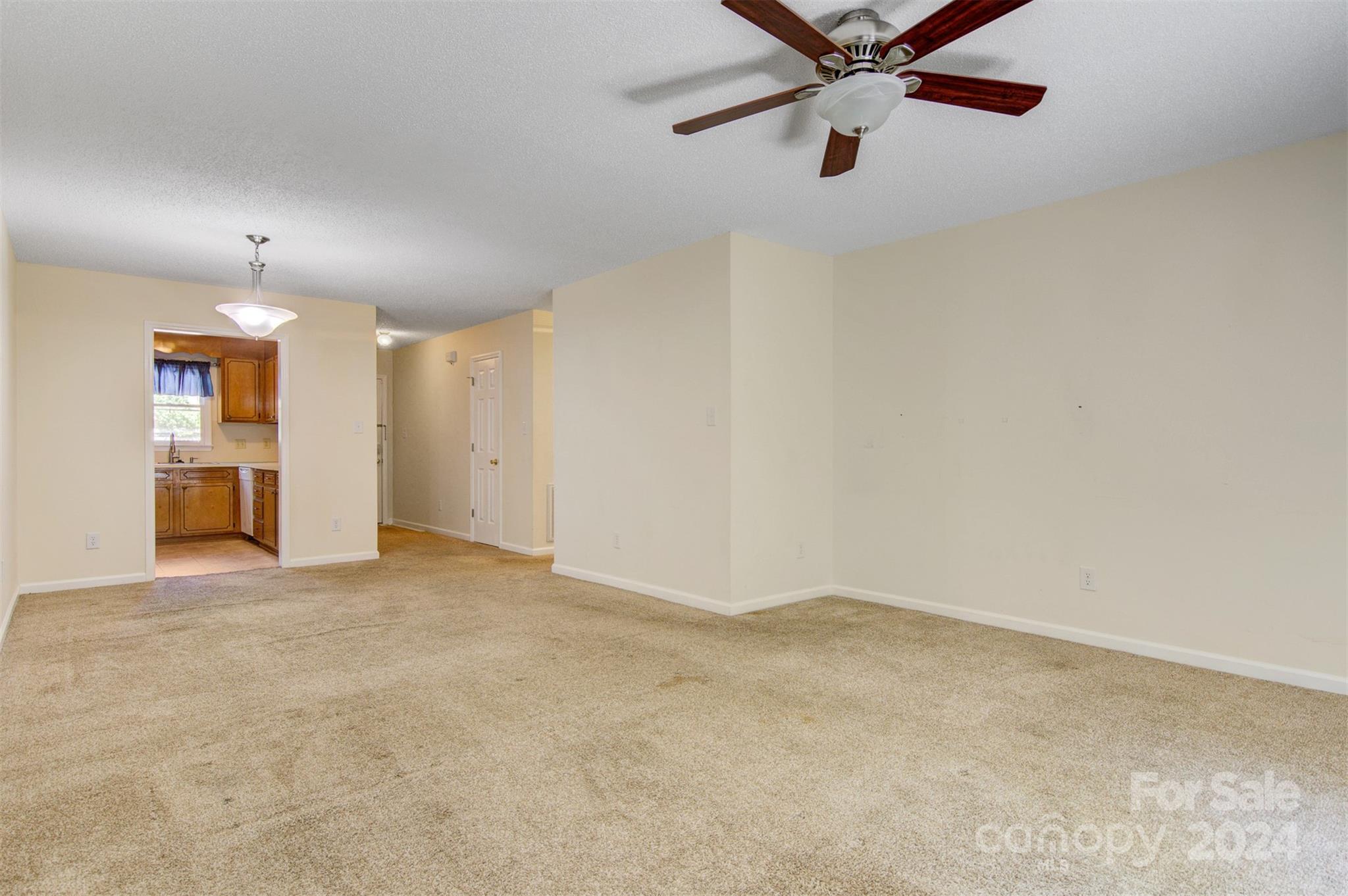 1318 5th Street Northeast Hickory, NC 28601 - Photo 9 of 27 an empty room with closet and windows
