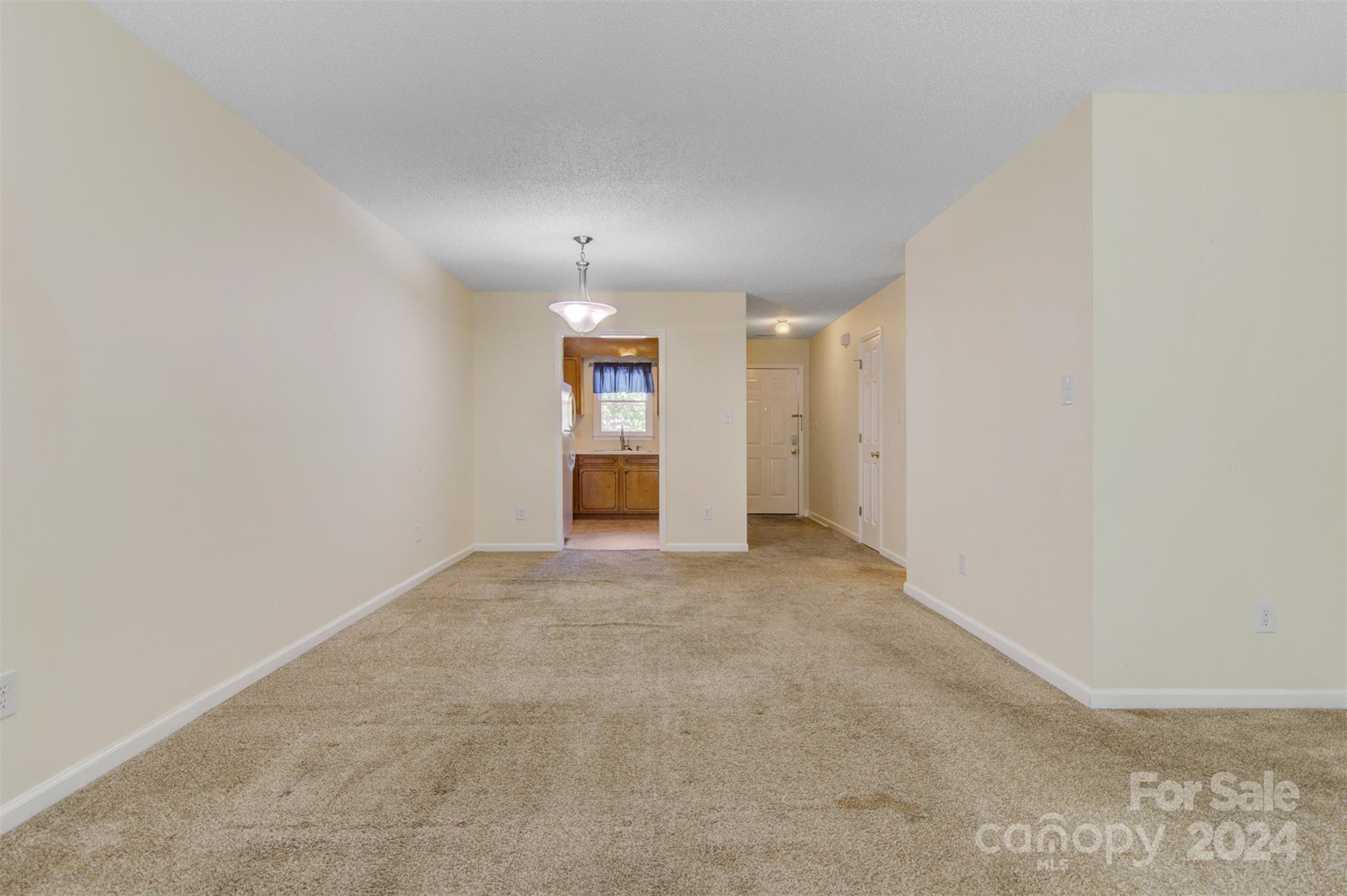 1318 5th Street Northeast Hickory, NC 28601 - Photo 10 of 27 an empty room with a empty space and windows
