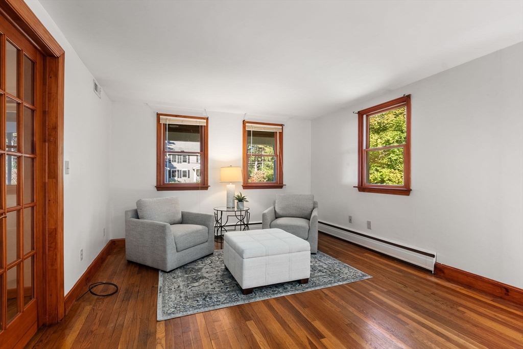 45 Bent Road Sudbury, MA 01776 - Photo 20 of 42 a living room with furniture and a wooden floor