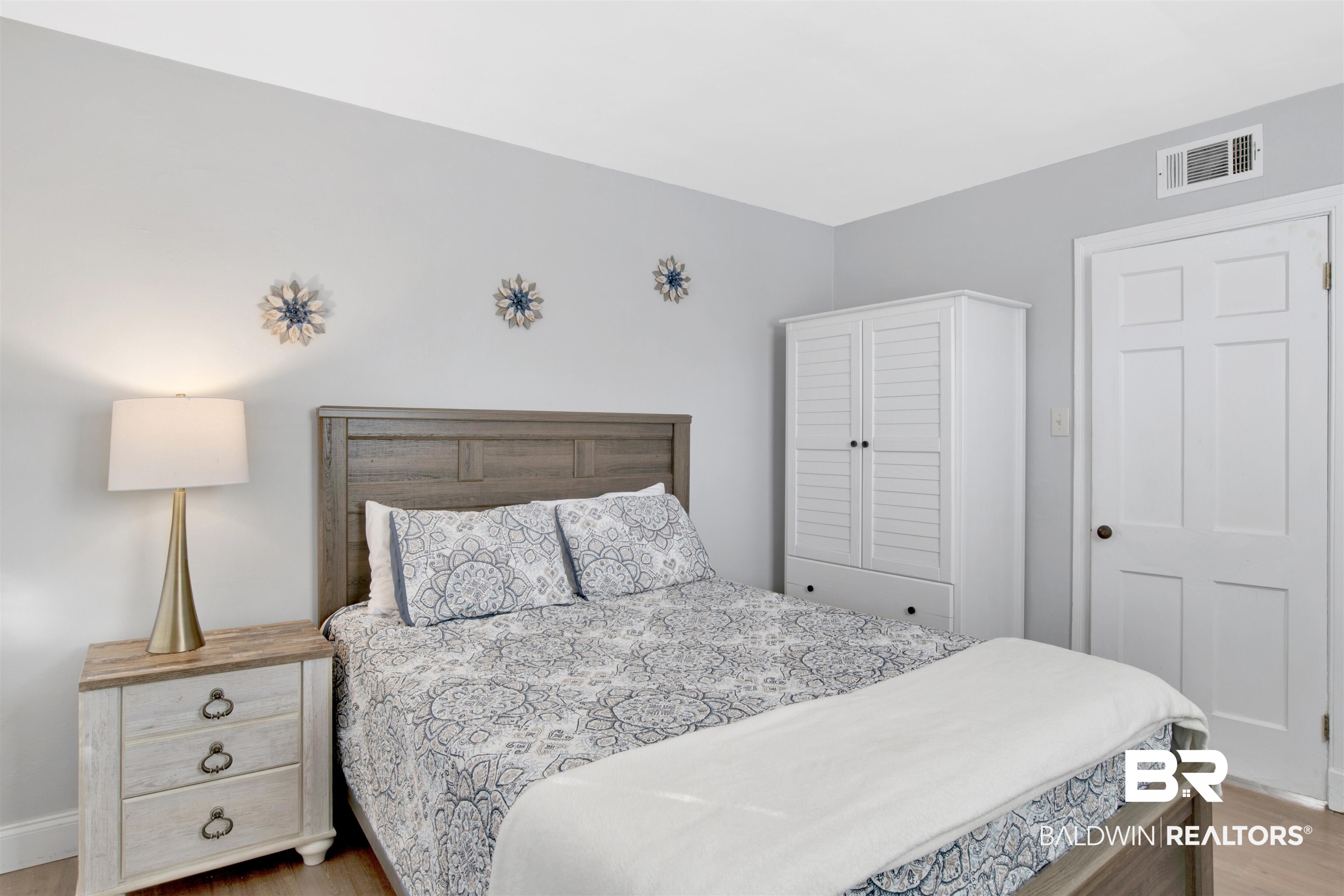 214 Upham Street, Unit 7A Mobile, AL 36607 - Photo 15 of 35 Bedroom featuring light wood-style flooring and baseboards