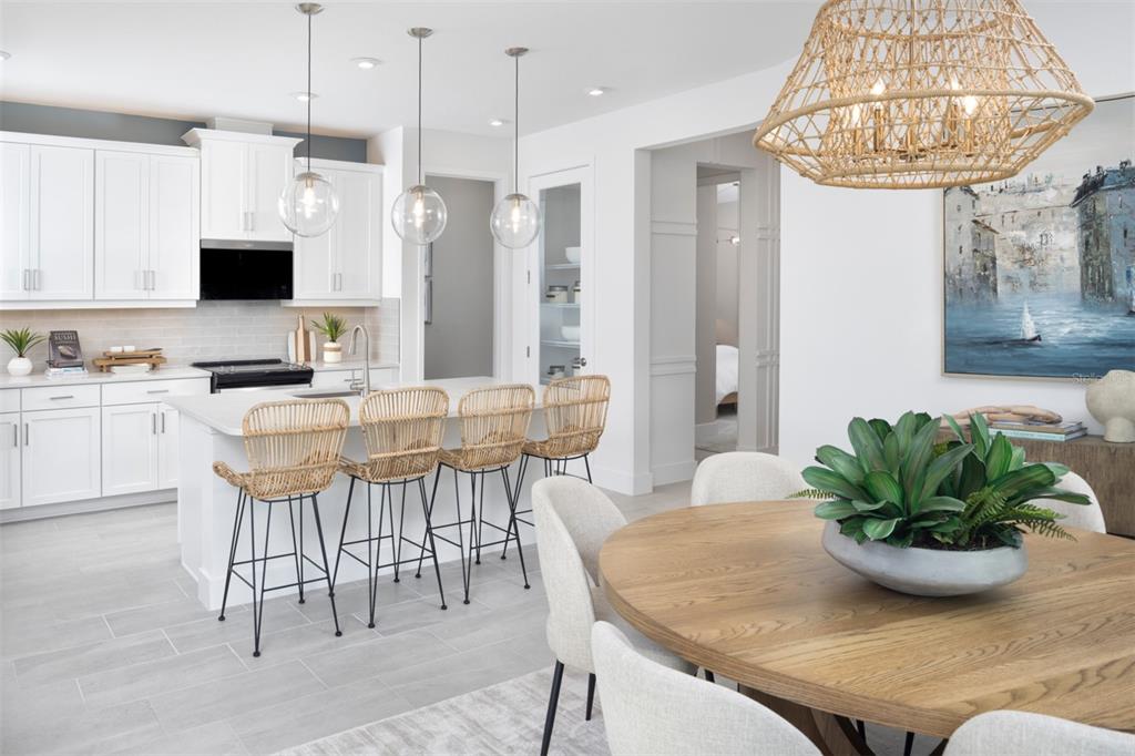 11840 Boundless Terrace Venice, FL 34293 - Photo 4 of 40 a view of a dining room with furniture