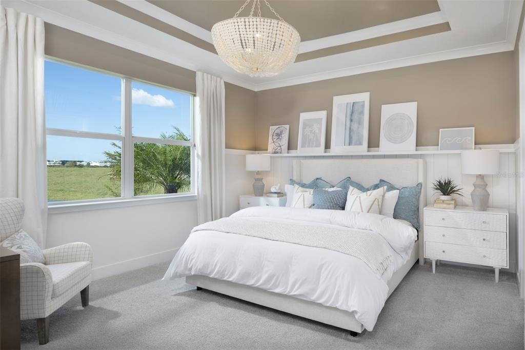 11840 Boundless Terrace Venice, FL 34293 - Photo 10 of 40 a bedroom with a large bed and a window