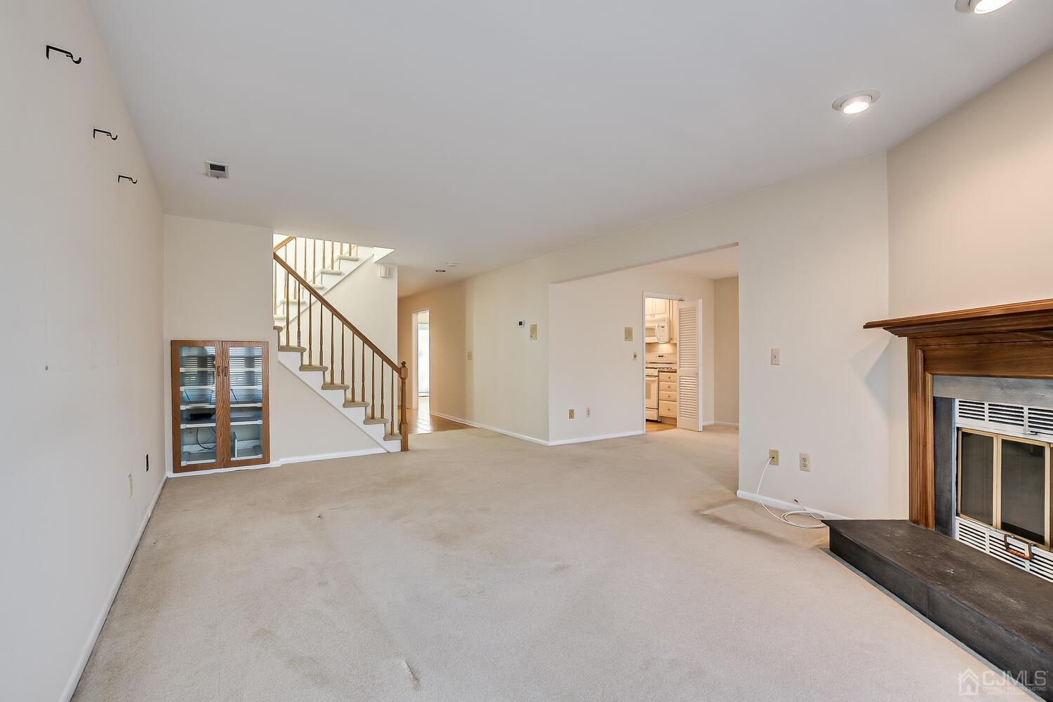 96 Heather Court Edison, NJ 08820 - Photo 22 of 37 a view of an empty room with fireplace and a window